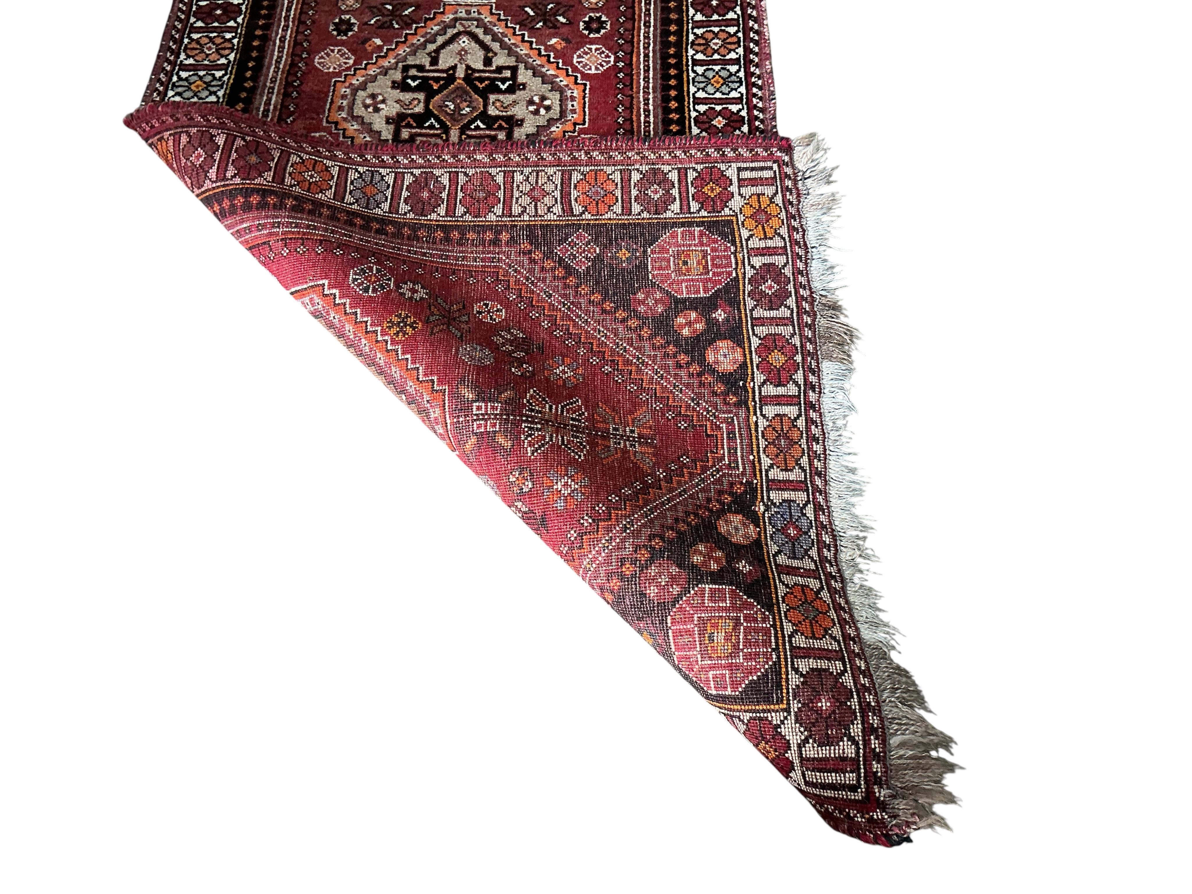 A Hamadan red ground rug, 204 x 140cm